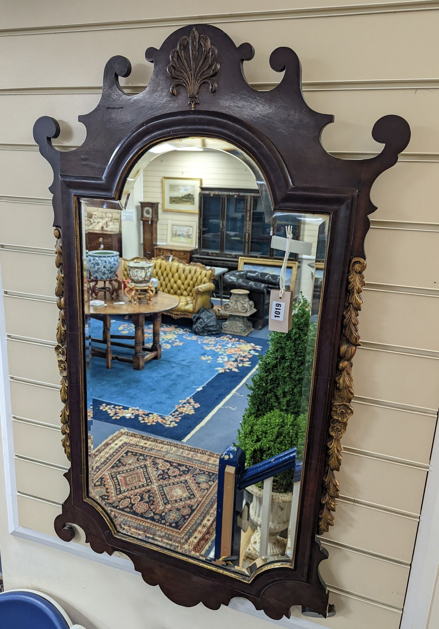 An early 20th century George III style parcel gilt fret cut mahogany wall mirror, width 59cm, height 112cm